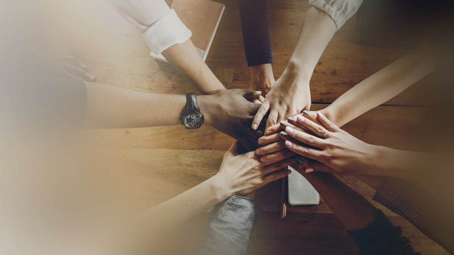 Hands joining together in a spirit of collaboration